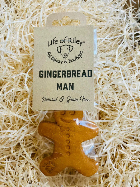 Hand-baked Gingerbread Men for dogs, made with grain-free peanut butter and ginger, perfect for a healthy treat.
