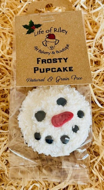 Festive dog pupcake featuring Frosty the Snowman, grain-free, low fat, and topped with sugar-free meringue icing.